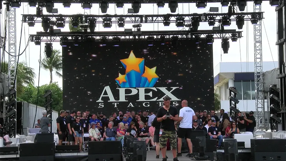 APEX mobile stage with LED wall in front of a festival crowd