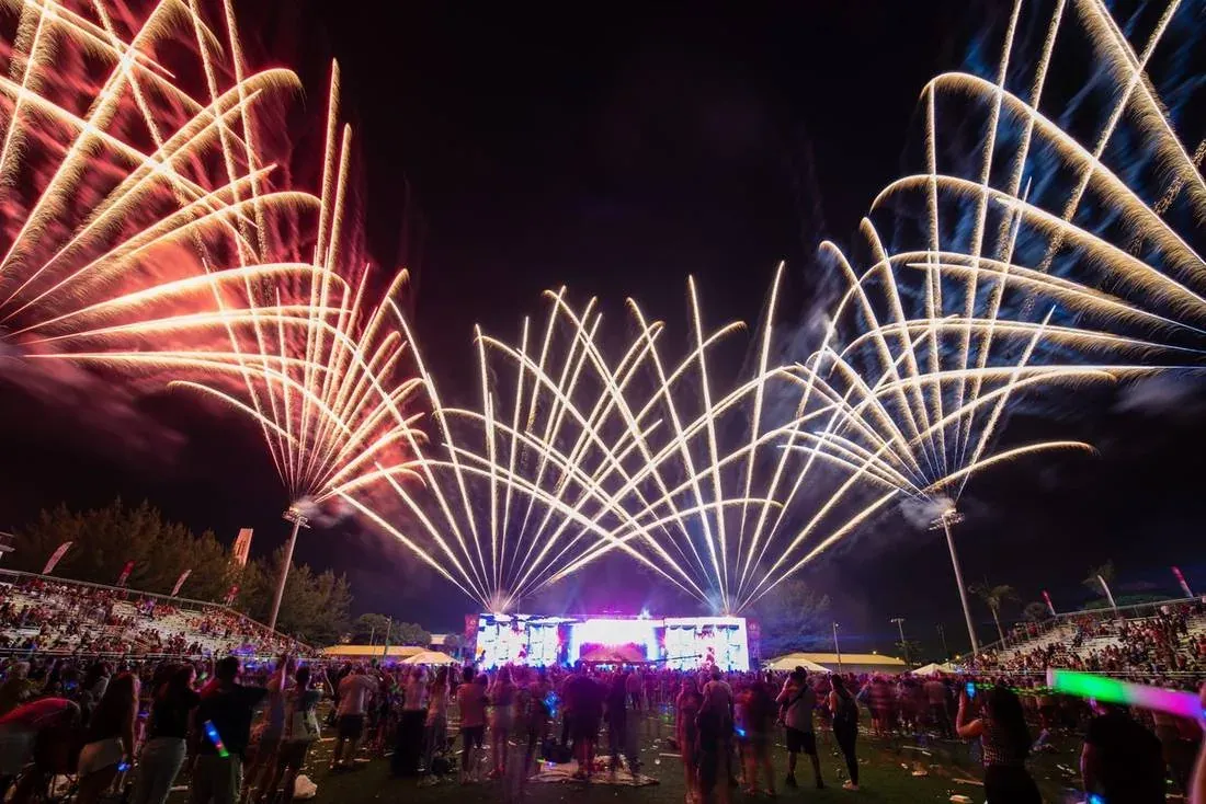 Fireworks bursting around the APEX stage at the Hialeah 4th of July celebration